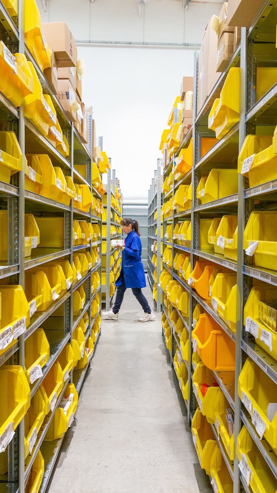 Freight warehouse with yellow storage bins